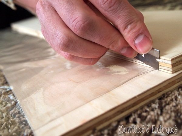 Cutting clear plastic for child-proofing dining chairs {Sawdust and Embryos}