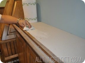 cleaning cabinets in kitchen