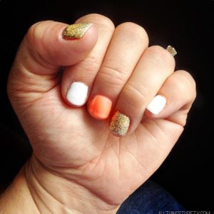 Coral, Gold, and White Fingernail Polish thumbnail