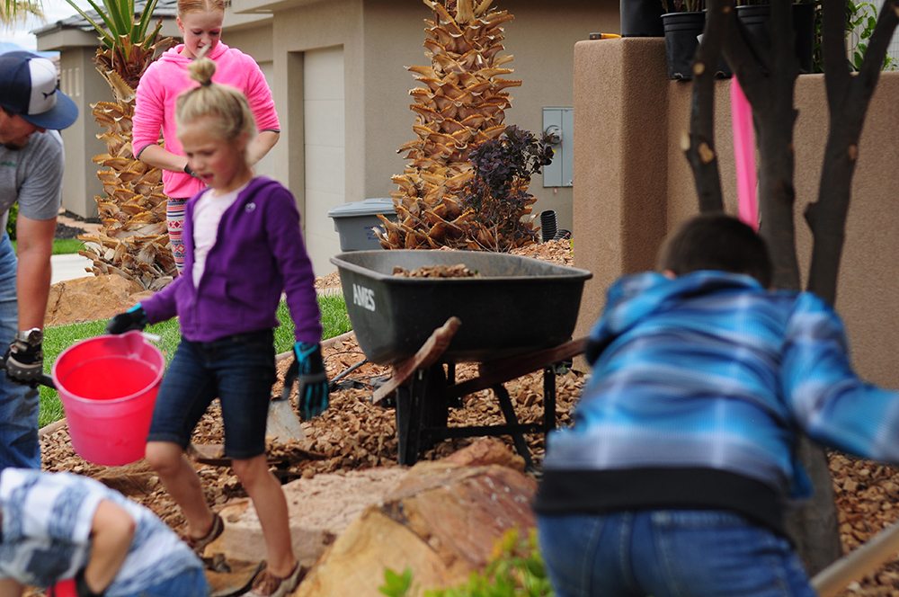 kids working in front yard for web