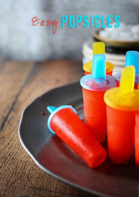 Easy Popsicles are a simple 2-ingredient pop recipe that's sure to cool you down through these hot summer months. So simple the kids can make them all on their own. Definitely a summertime favorite!