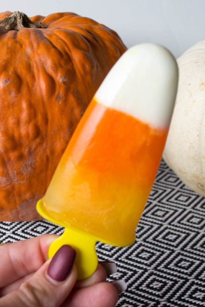 These Candy Corn Popsicles are perfect sweet treat made from greek yogurt and fruit juices A great alternative with a fun twist!