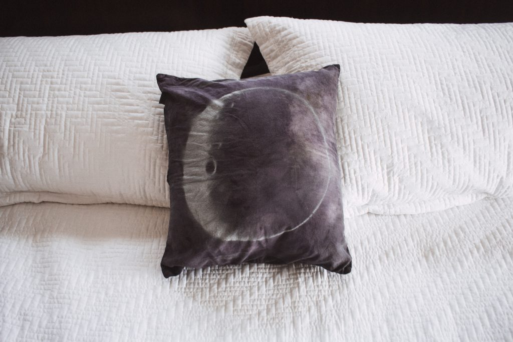 This moon pillow is a perfect quick project for a meditation area or even just your bedroom or office! All you need is a pillow, stencil and a can of spray paint.