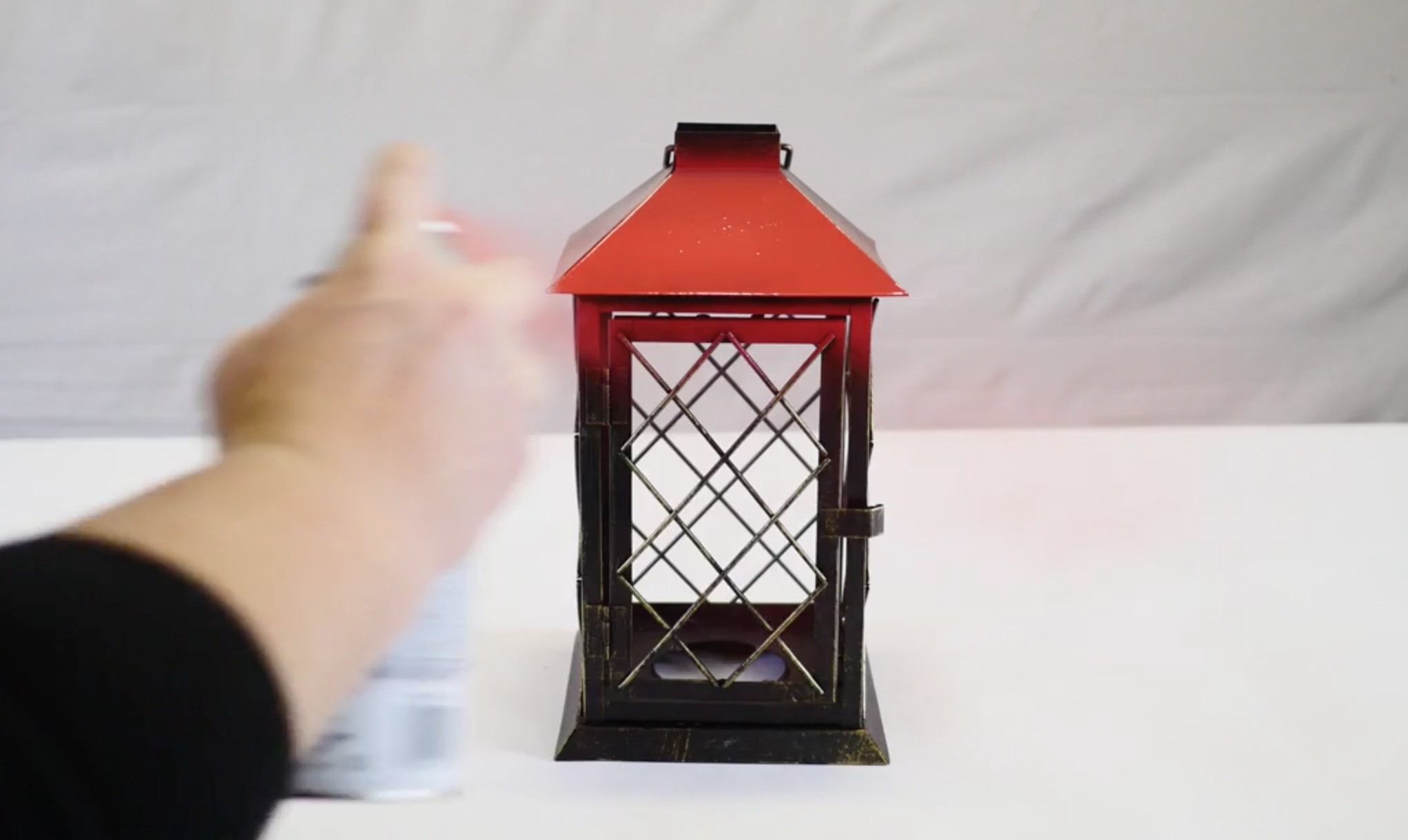 Spray painting a lantern