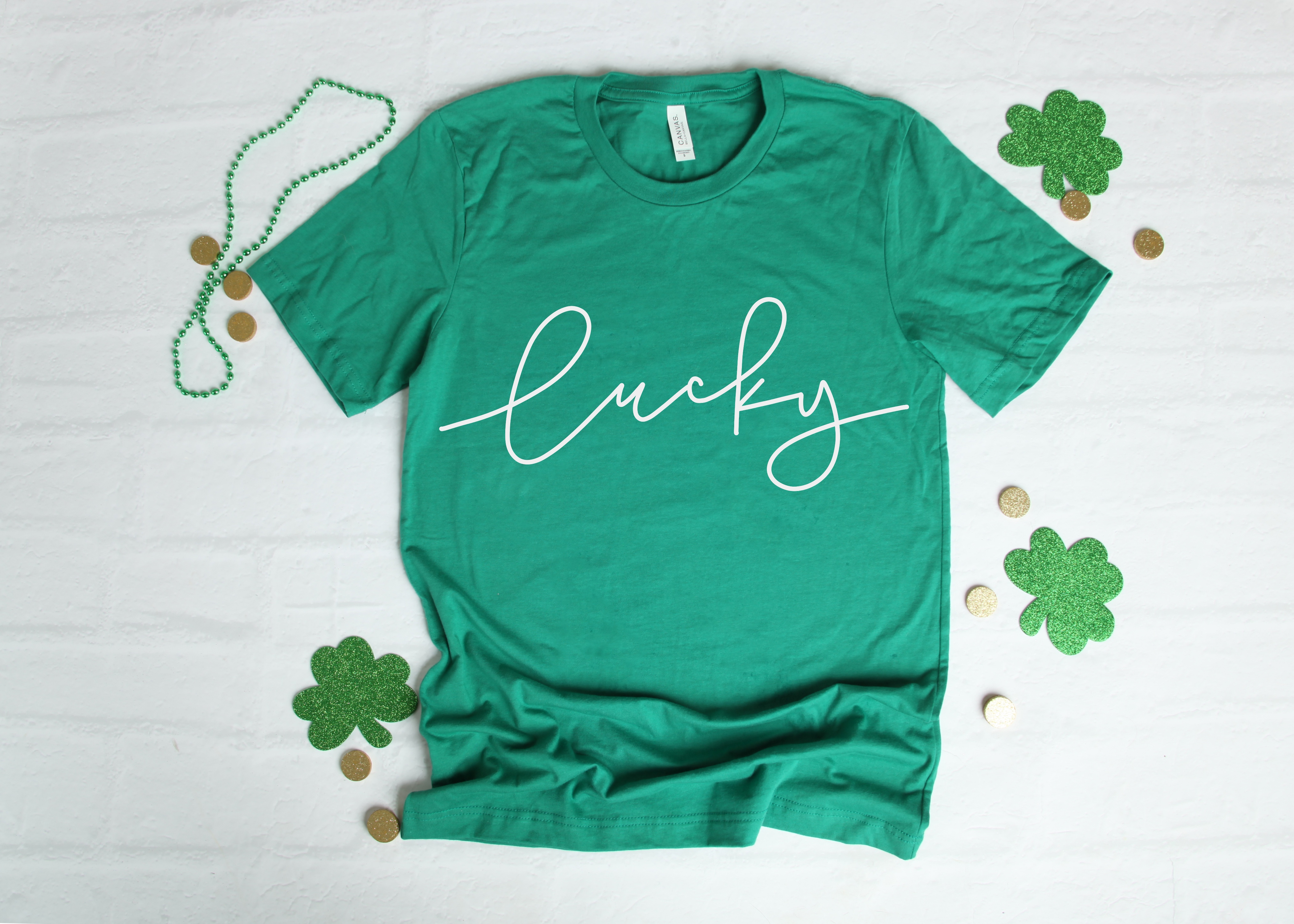 Green shirt with the phrase "Lucky" in white