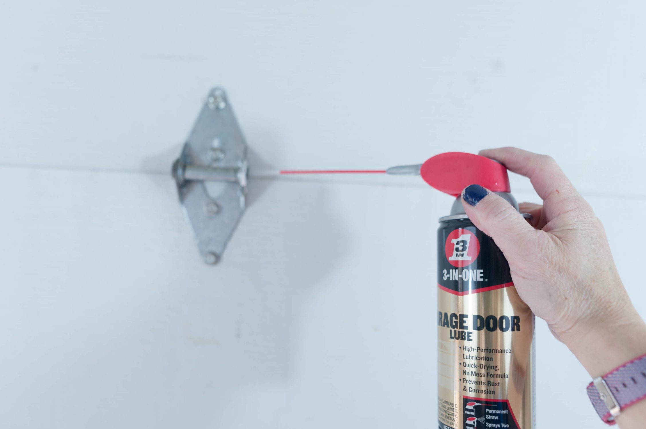 How to fix a squeaky garage door with 3 in One Garage Door Lube  #garagedoorrepair #diy 